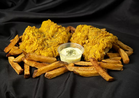 Alaskan Catch Fish and Chips - Beer-battered Alaskan cod served with crispy fries and tartar sauce